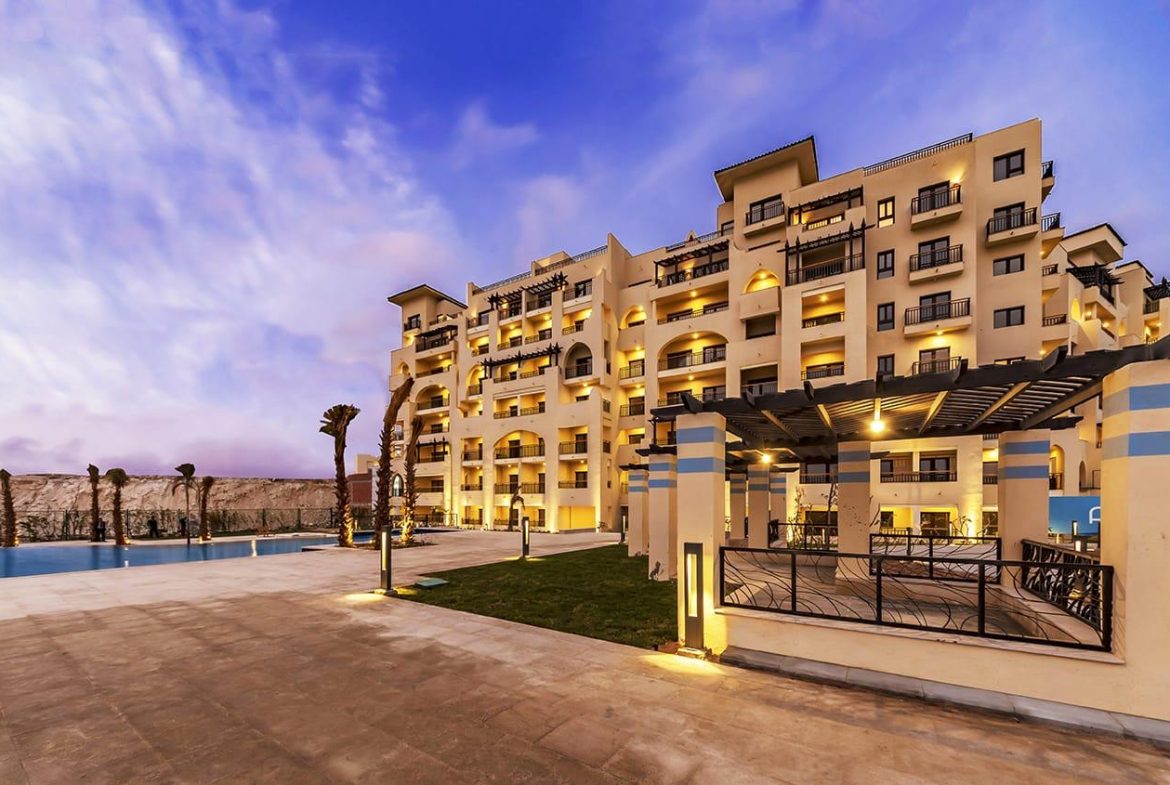 ALDAU Heights apartment buildings beside landscaped grounds
