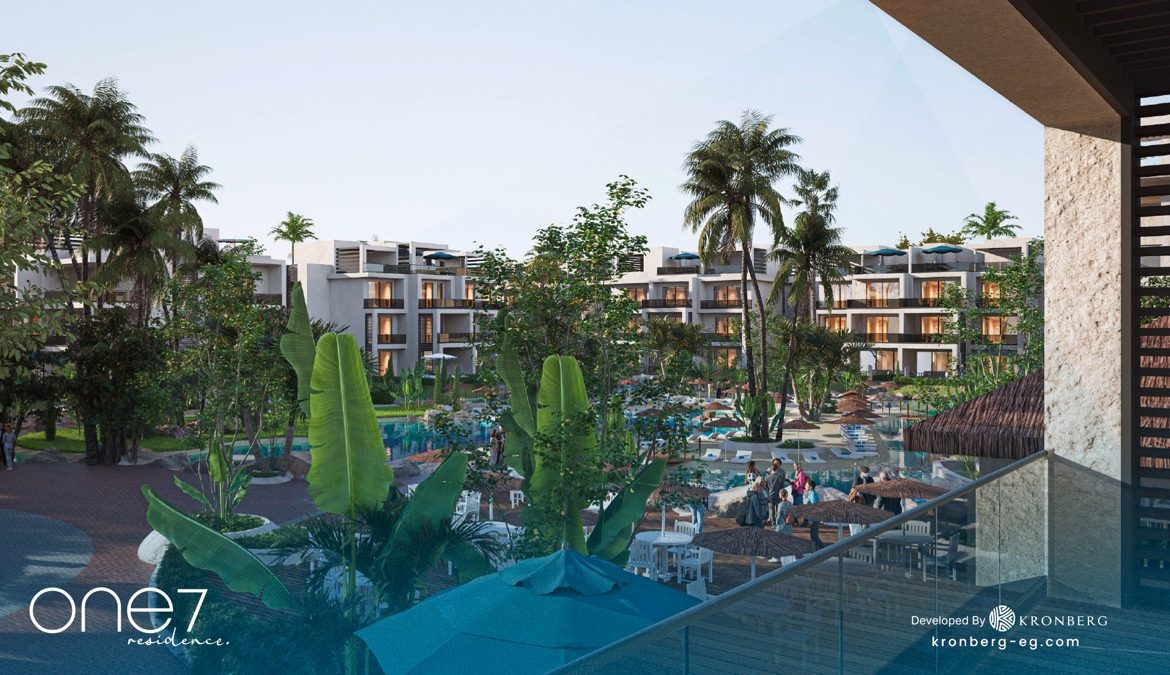 One7 Hurghada apartments – lagoon and landscaped courtyard seen from a terrace, developer rendering