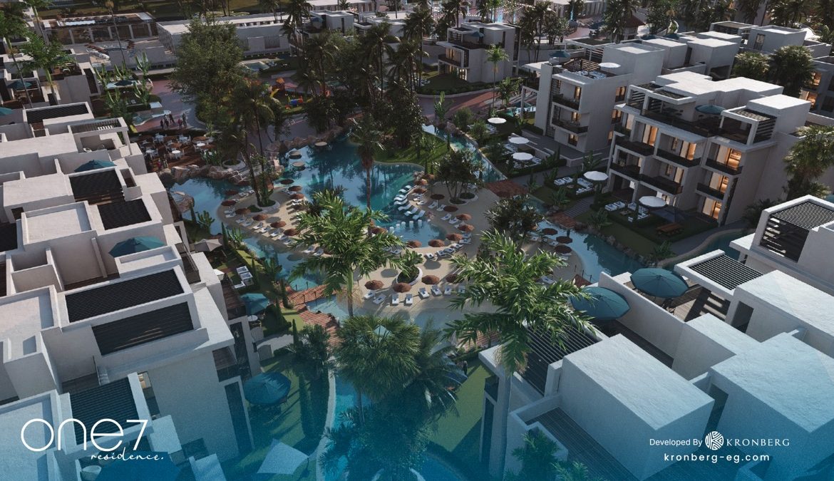 One7 Hurghada penthouse – aerial view of apartment rooftops and winding lagoon, developer rendering