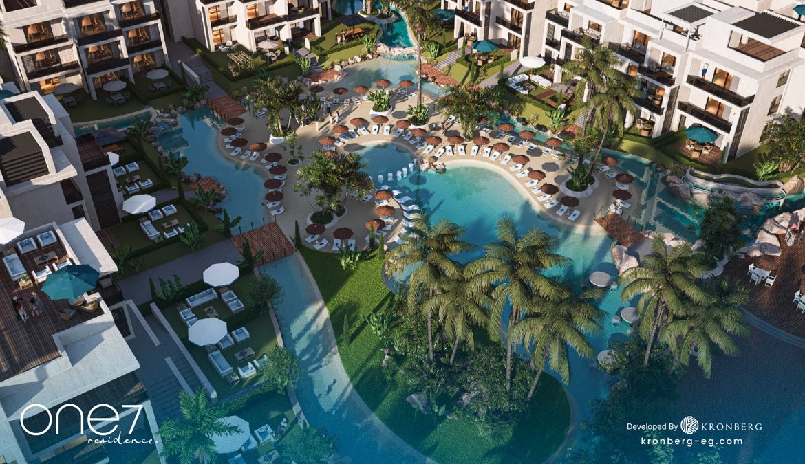 One7 Hurghada apartments – overhead view of lagoon landscaping and sun loungers, developer rendering