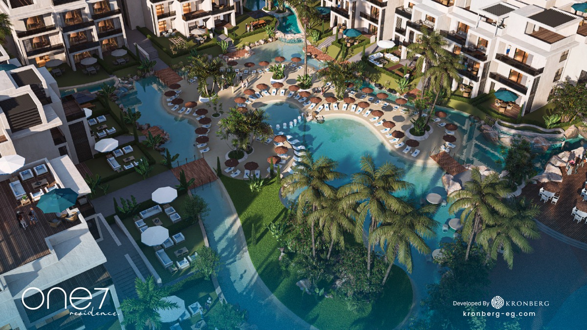 One7 Hurghada apartments – overhead view of lagoon landscaping and sun loungers, developer rendering
