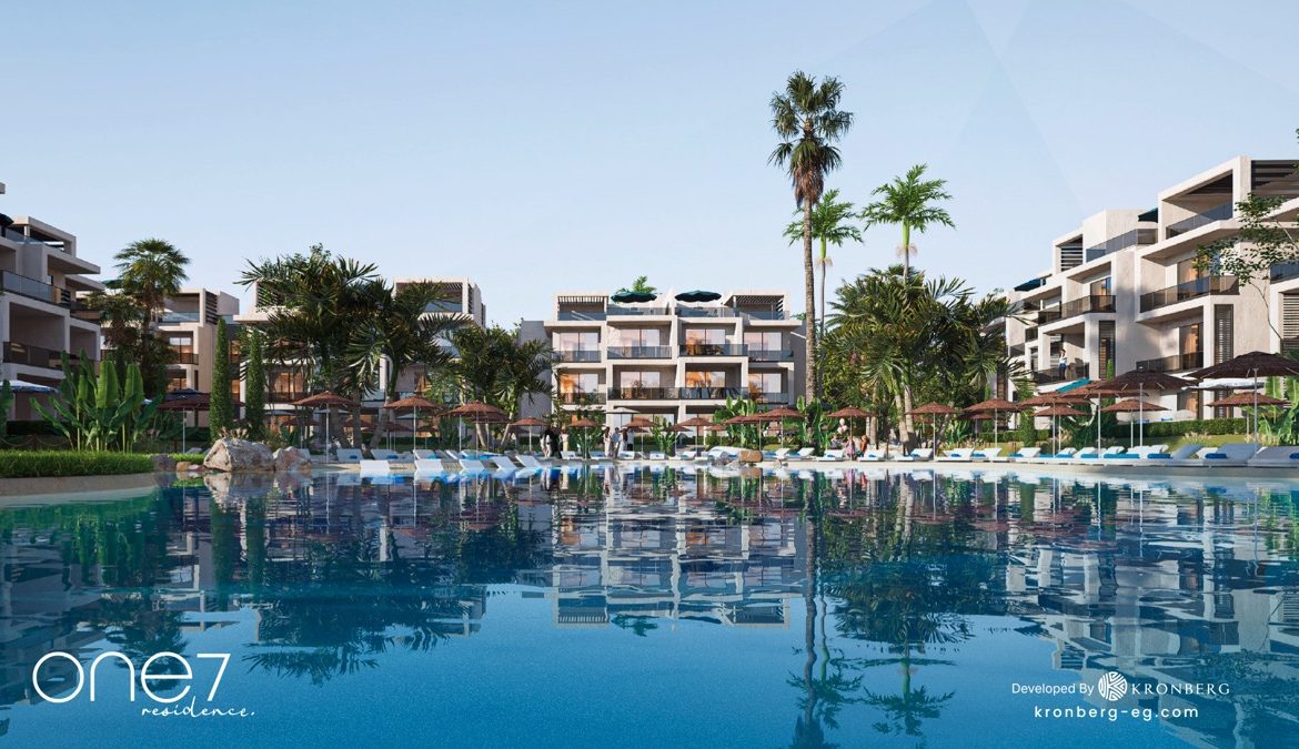 One7 apartments for sale – water-level view of the lagoon and apartments, developer rendering