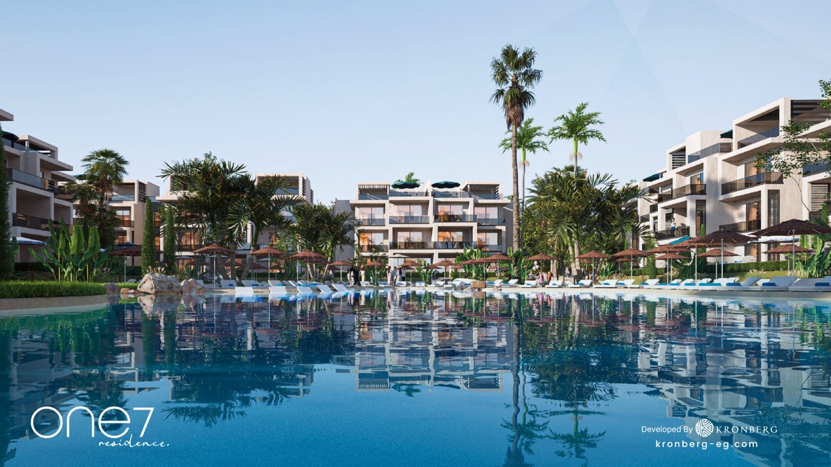 One7 apartments for sale – water-level view of the lagoon and apartments, developer rendering