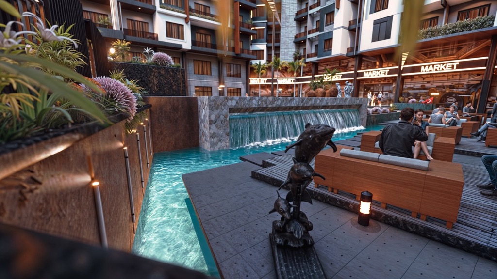 Iconic Resort Hurghada – terrace seating overlooking the courtyard pool, developer render