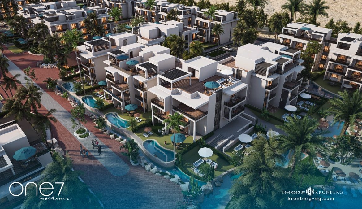 One7 Hurghada apartments – apartment rooftops beside the winding lagoon, developer rendering