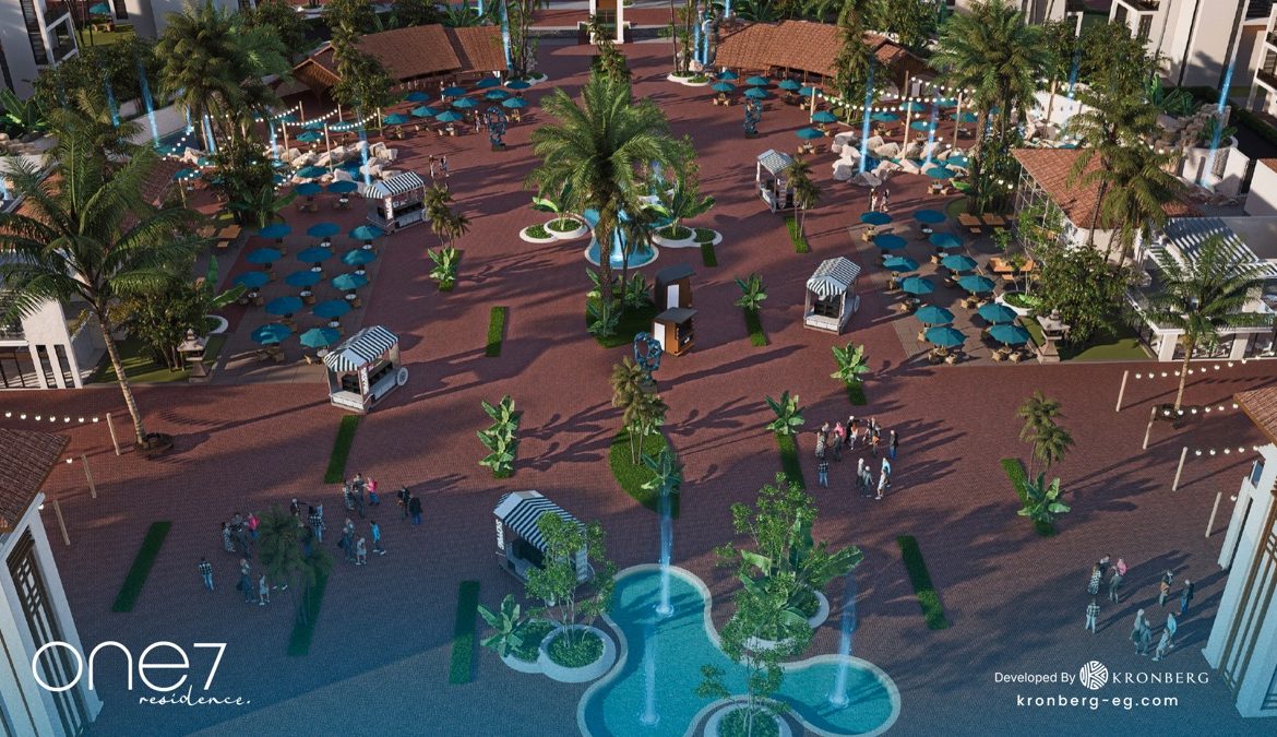 One7 Hurghada – central plaza with palms and decorative water features, developer rendering