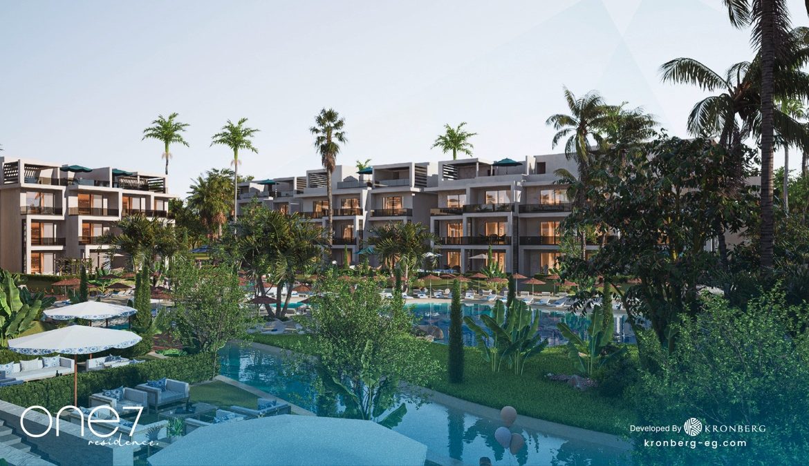 One7 apartments for sale – landscaped lagoon and apartment buildings, developer rendering