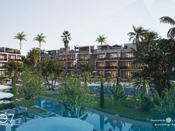 One7 apartments for sale – landscaped lagoon and apartment buildings, developer rendering