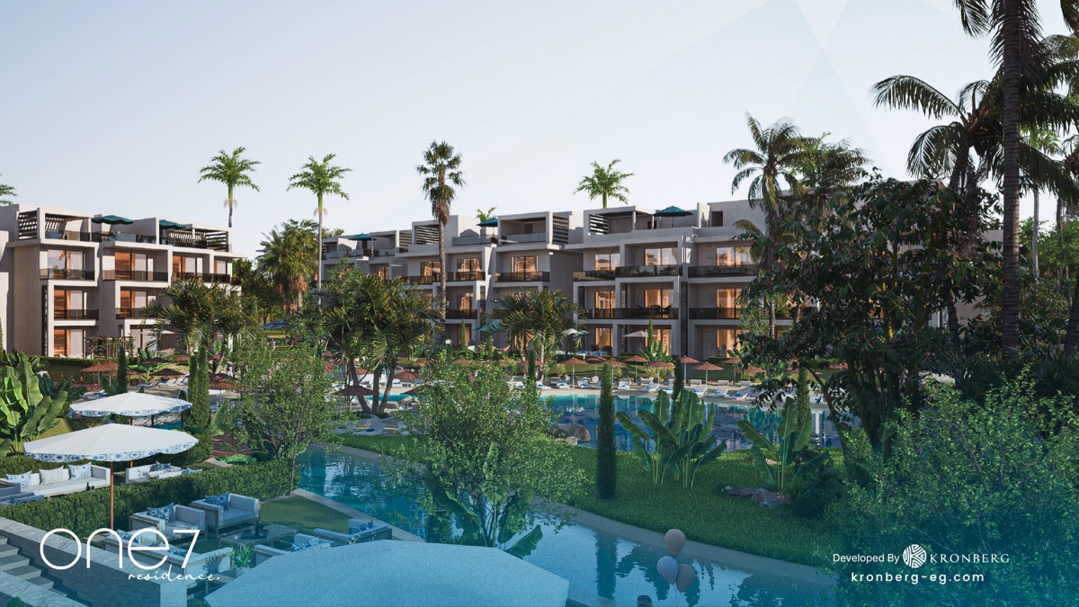 One7 apartments for sale – landscaped lagoon and apartment buildings, developer rendering